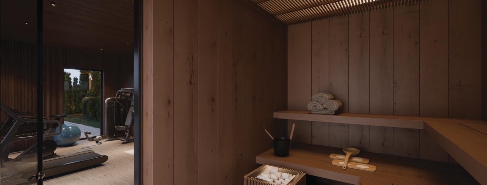 Maxi Marbella gym with wooden slat walls, treadmill, and wicker chairs.