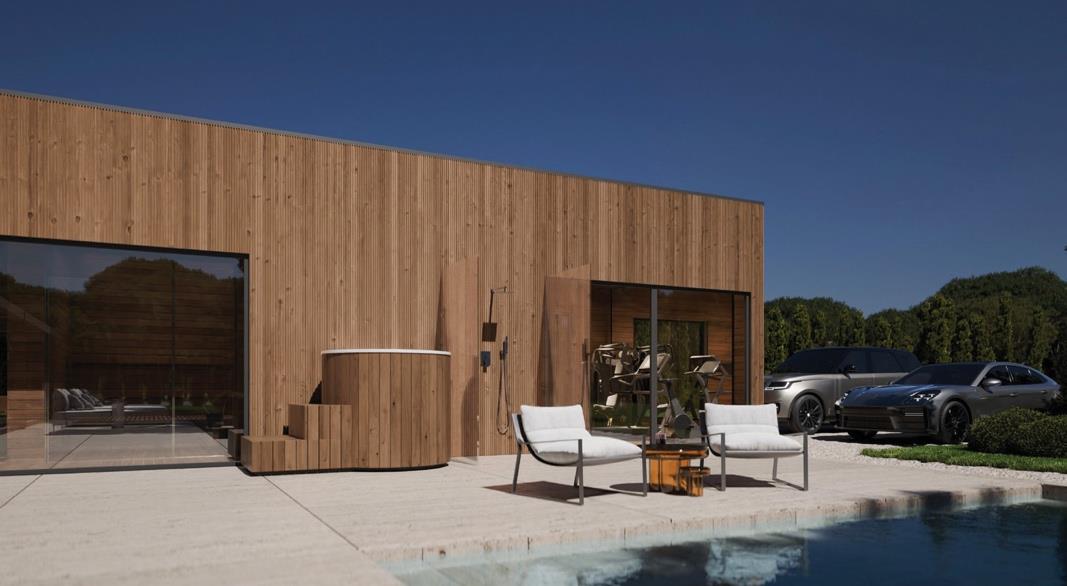 Modern living room with wooden walls, grey sofa, and dining area.