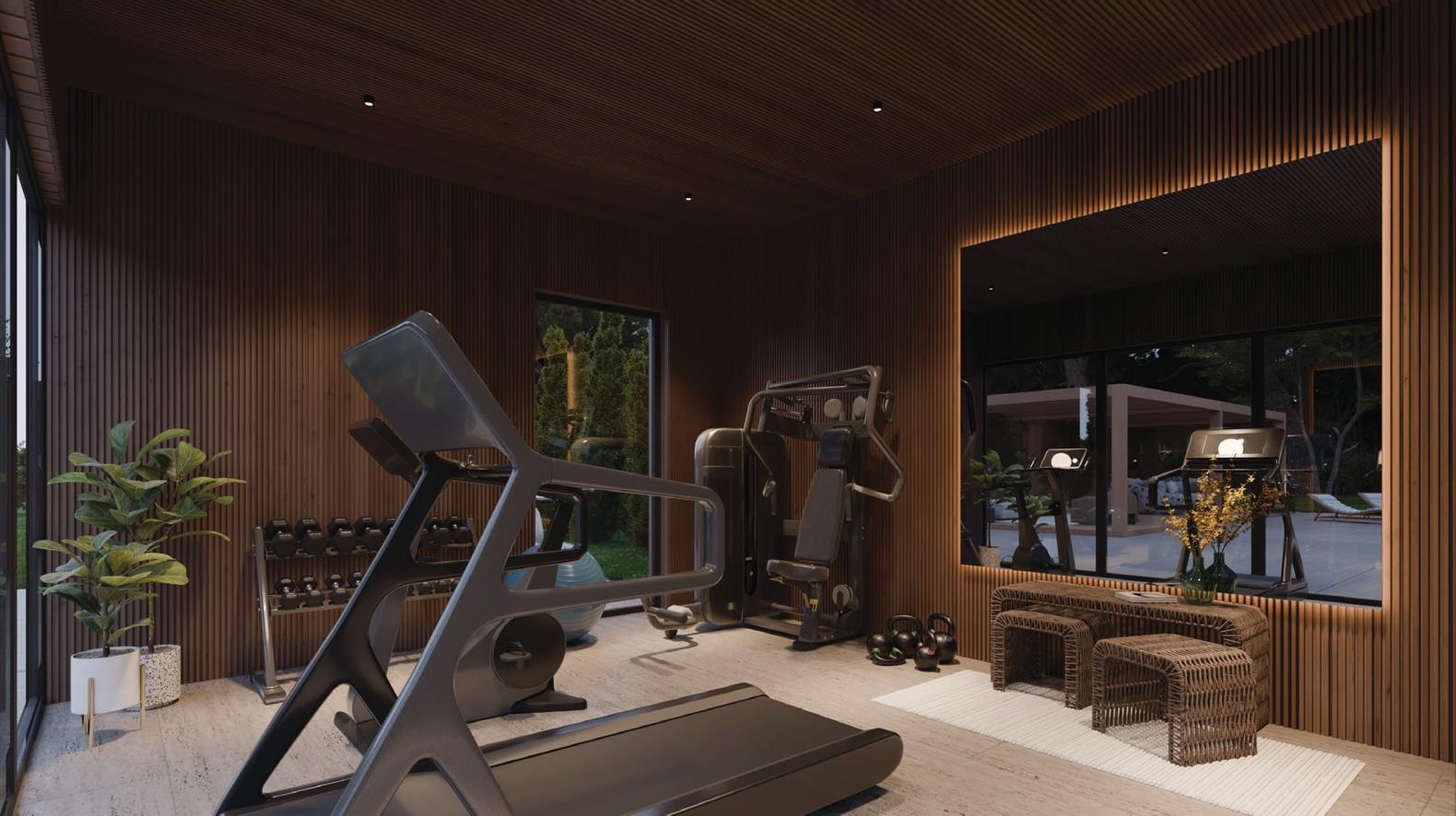 Sauna with wooden benches, rolled towels, and a small outdoor-view window.