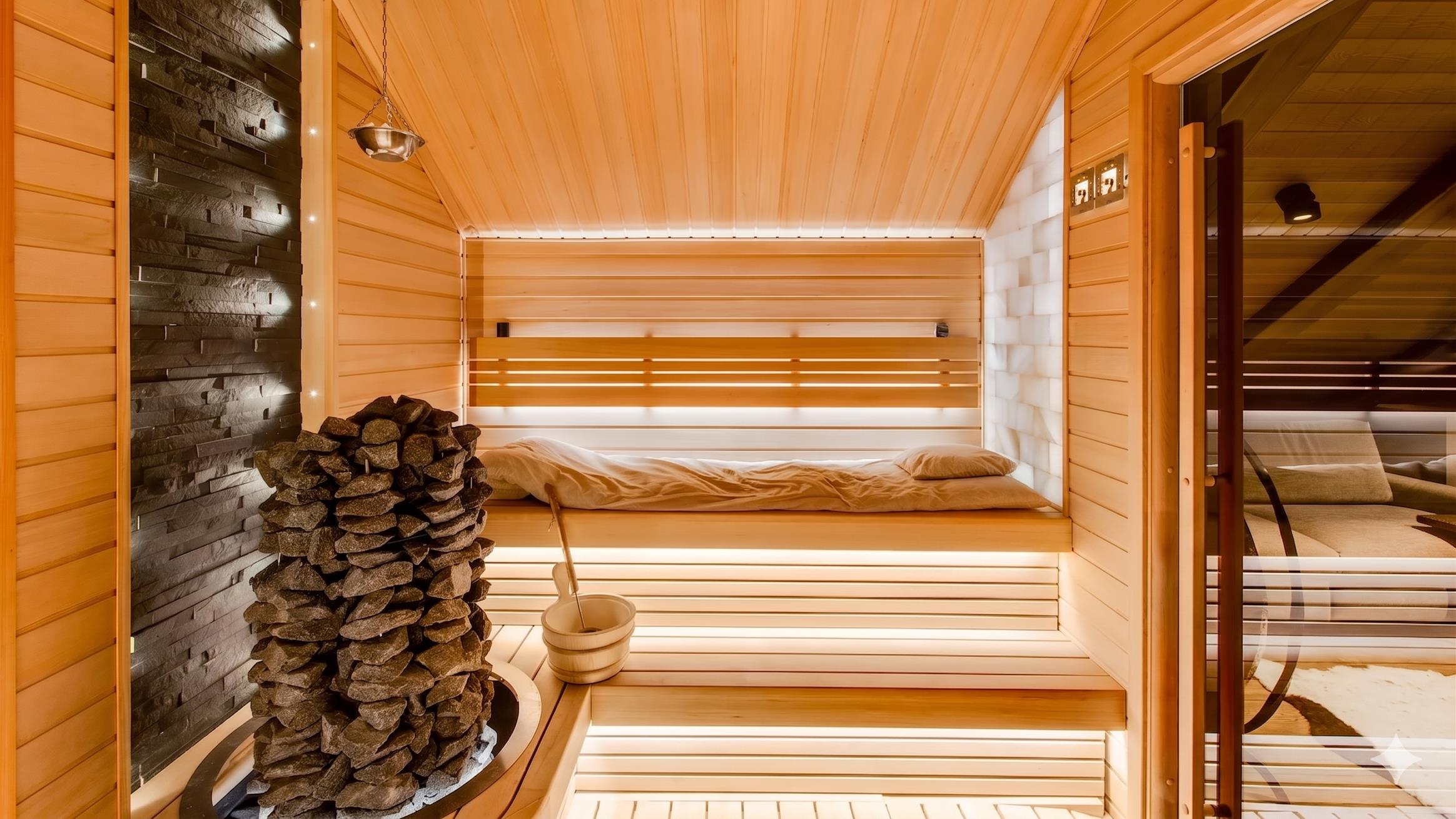 Spa House interior — sauna detail with stove and benches.